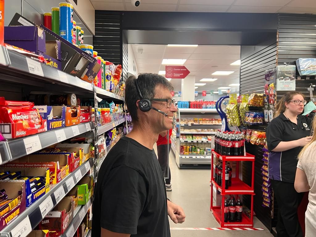 Retailer wearing Wildix headphones