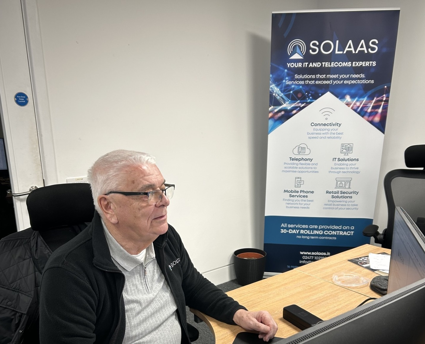 Stuart working at his desk